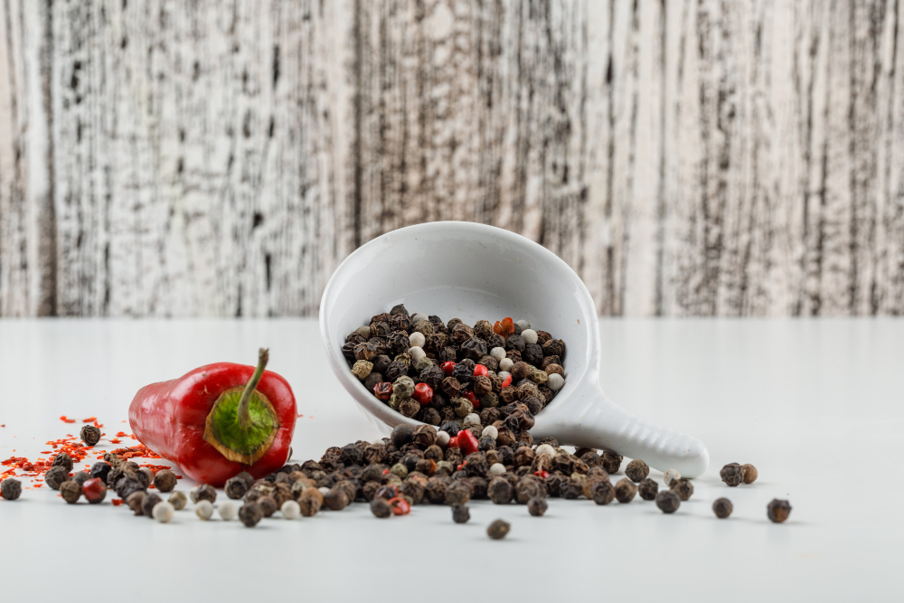 Mixed Peppercorns Plate With Red Pepper Side View White Wooden Grunge Wall