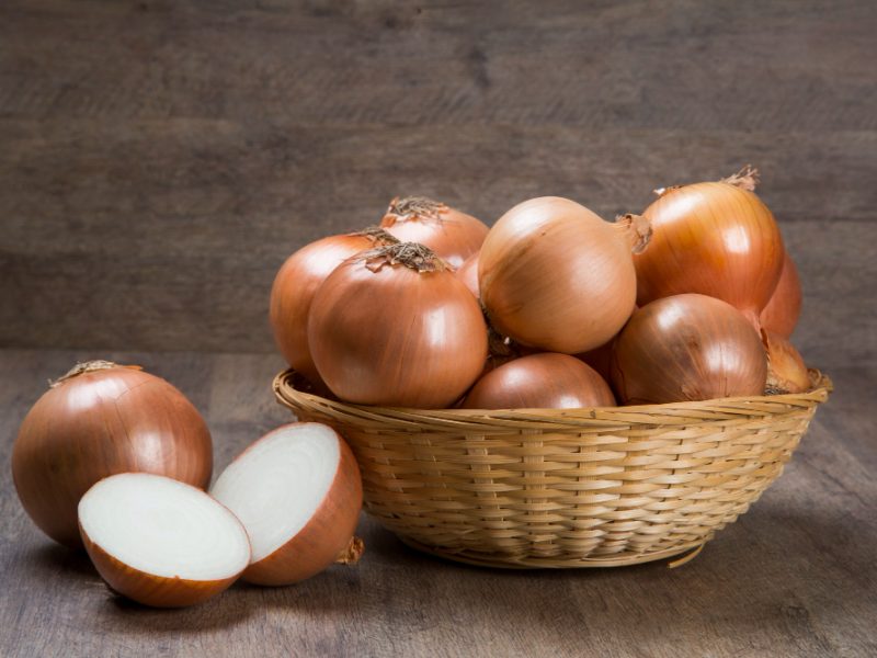 Assorted Farm Fresh Onions Rustic Wooden Table With Spring Onions