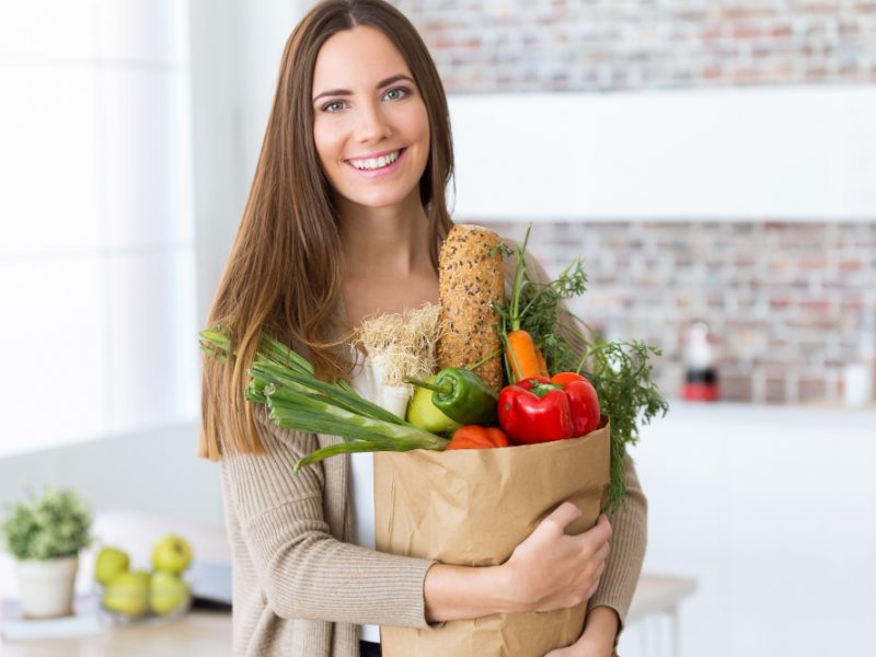 Beautiful Young Woman With Vegetables Grocery Bag Home