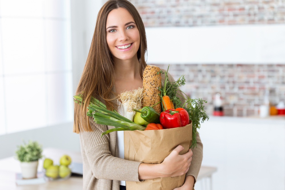Beautiful Young Woman With Vegetables Grocery Bag Home