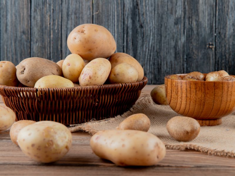 Side View Basket Bowl Full Potato Sackcloth Wooden Surface Background With Copy Space