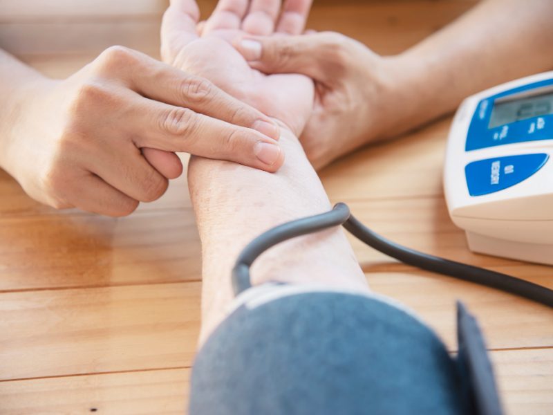 Old Lady Is Being Checked Blood Pressure Using Blood Pressure Monitor Kid Set