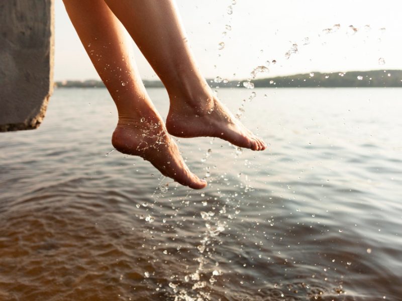 Side View Woman Playing With Her Feet Lake