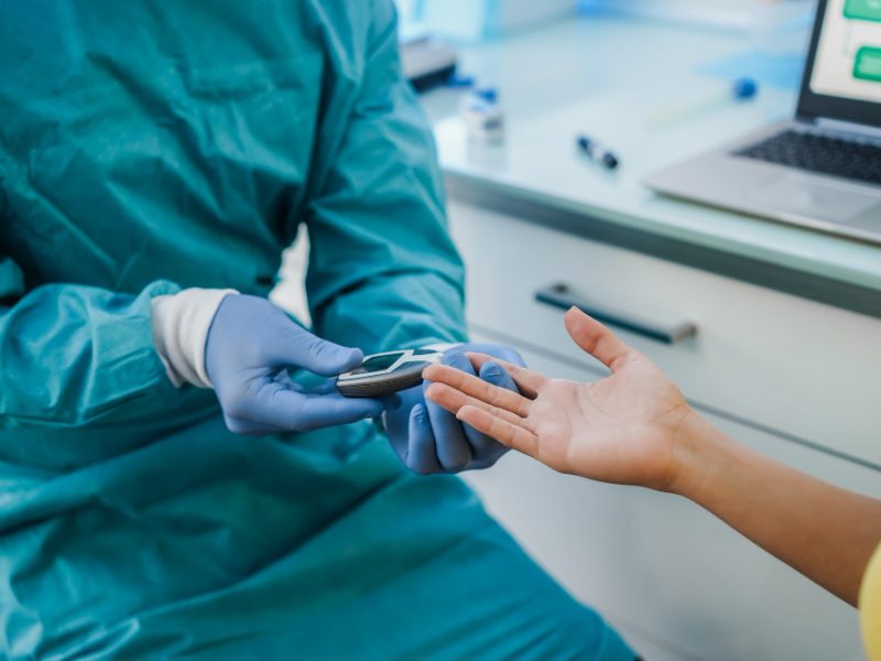 Medical Doctor Checking Blood Sugar Level Young Patient Diabetes Disease Control Focus Woman Hand