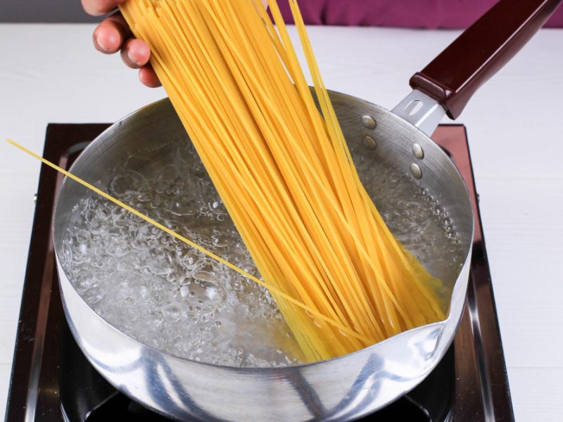 Women Cooking Spaghetti Pan Boiling Water Kitchen