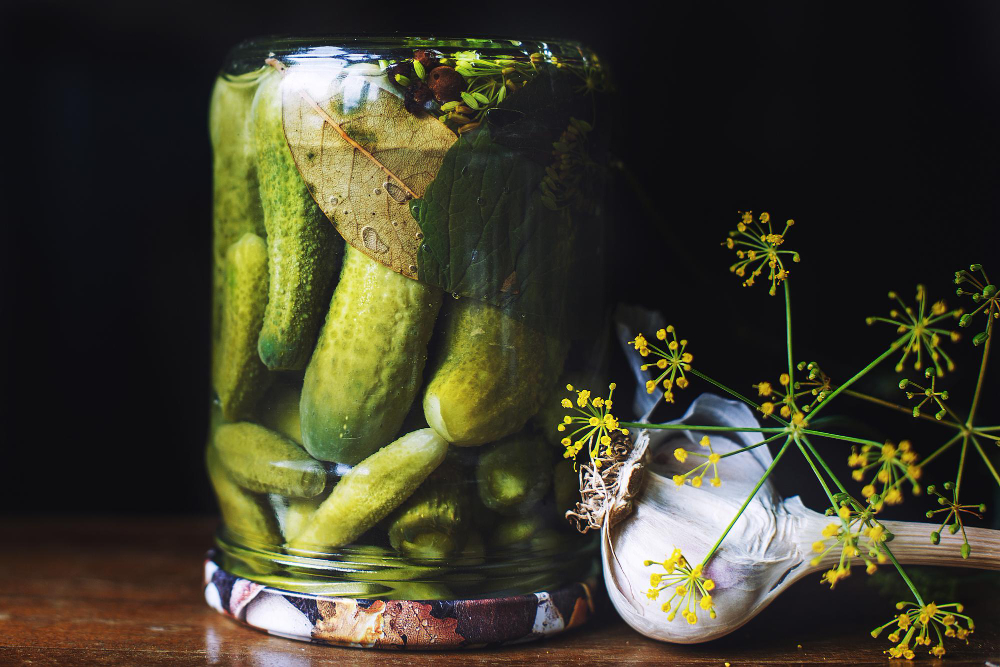 pickled-cucumbers-glass-jar-with-garlic-dill-dark-background