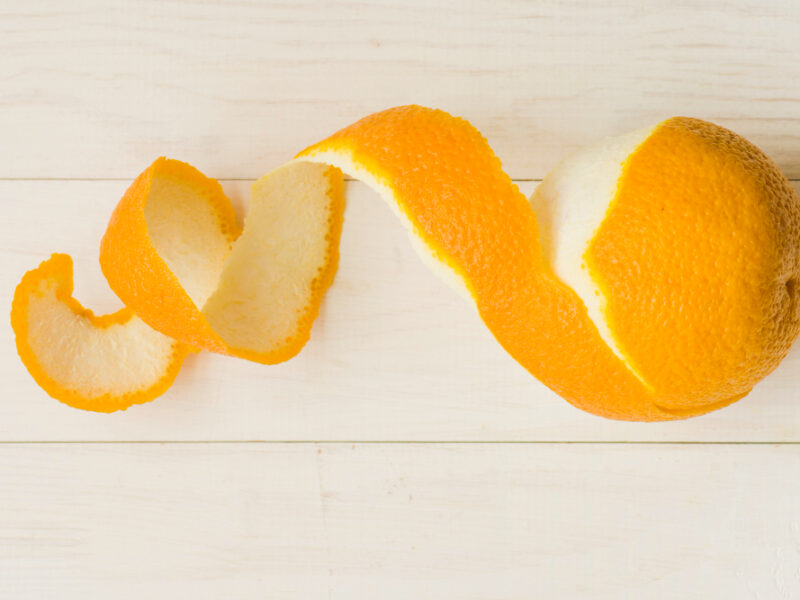 Peeled Orange Fruit Wooden Background