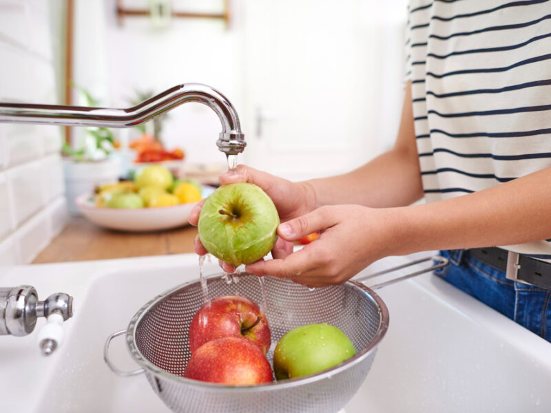Woman Washing Seasonal Fresh Apples