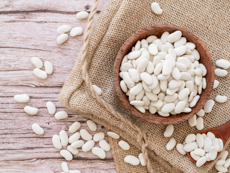 Top View White Beans Wooden Table