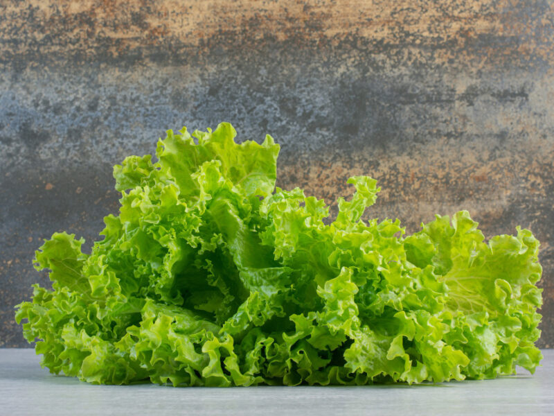 Fresh Green Lettuce Marble Background High Quality Photo
