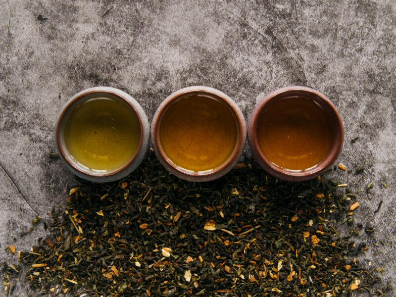 Herbal Chinese Teacup With Dried Tea Herb Concrete Backdrop