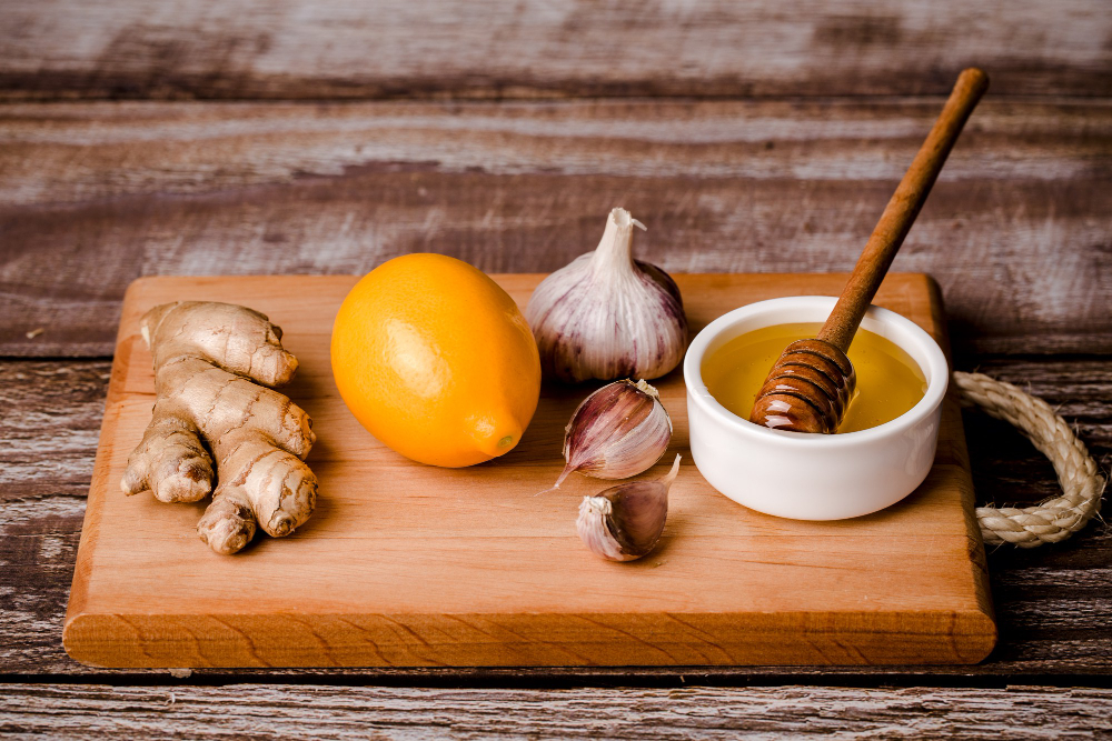 Healthy Food Immunity Kit Vitamin C Honey Ginger Root Lemon Garlic Wood Board Brown Background