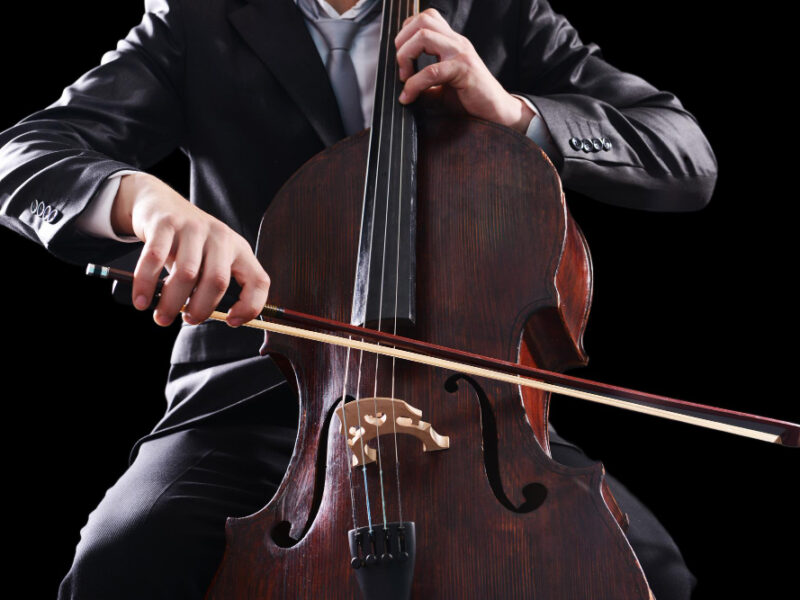 Man Playing Cello Dark Background