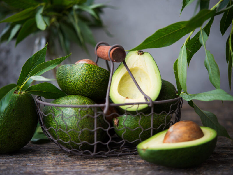 Fresh Green Avocado With Leaves Wooden Space