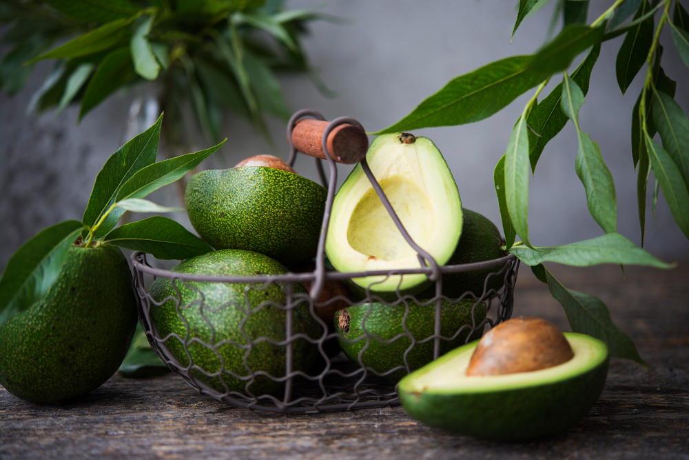 Fresh Green Avocado With Leaves Wooden Space