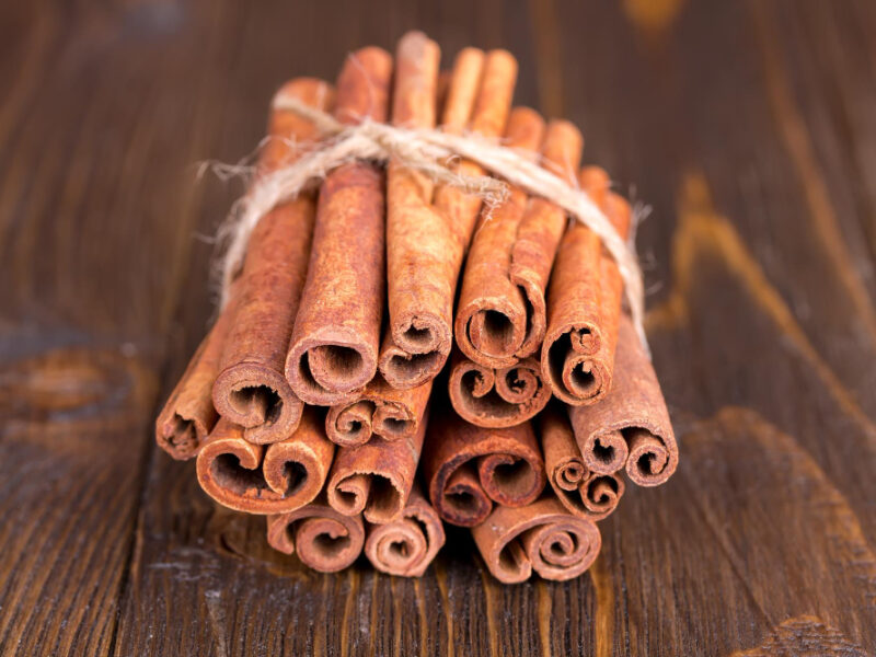 Cinnamon Sticks Wooden Background