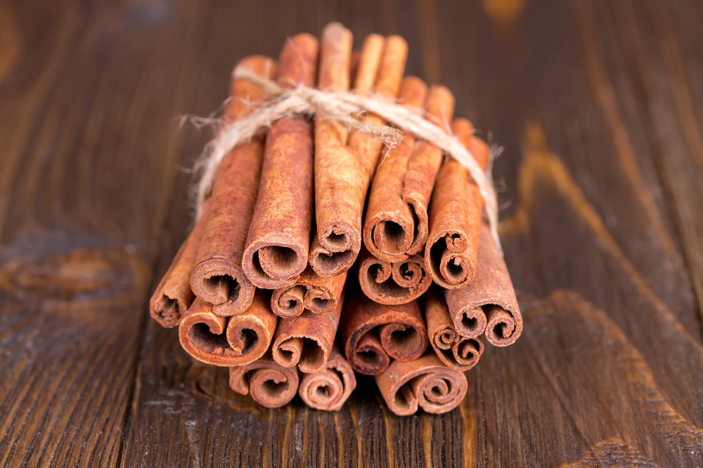 Cinnamon Sticks Wooden Background