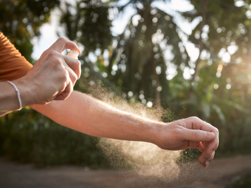 Man Applying Insect Repellent His Hand