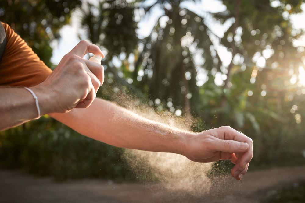 Man Applying Insect Repellent His Hand