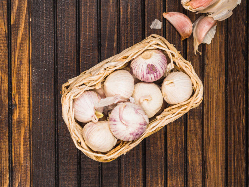 High Angle View Onions Basket Near Garlic Cloves Wooden Background