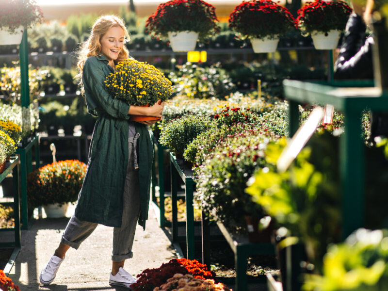 Young Woman With Beautiful Blond Hair Gentle Smile Dressed Green Robe With Belt Is Working Greenhouse