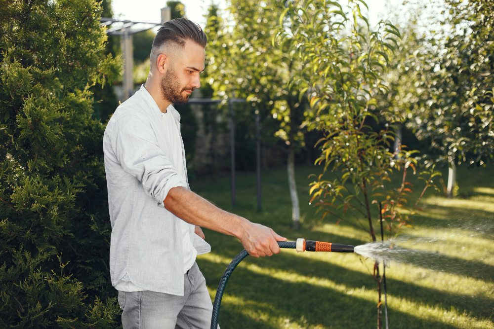 Man Watering His Plants His Garden Man Blue Shirt