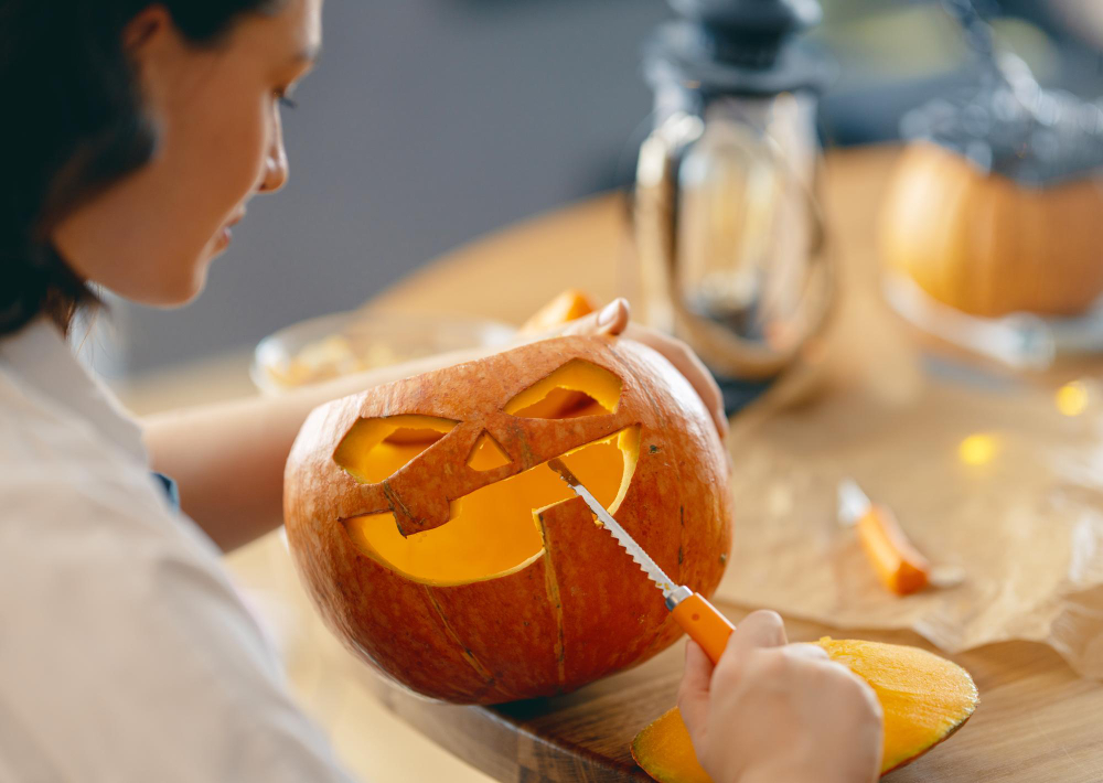 Woman Is Carving Pumpkin