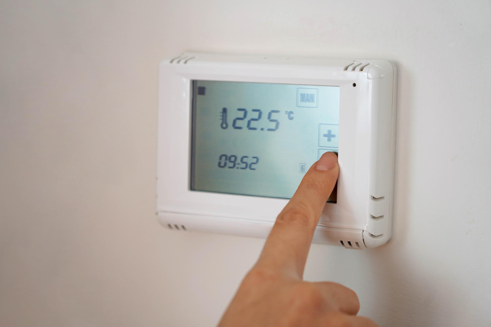 Saving Energy Concept Human Hand Turning Down Temperature Digital Display