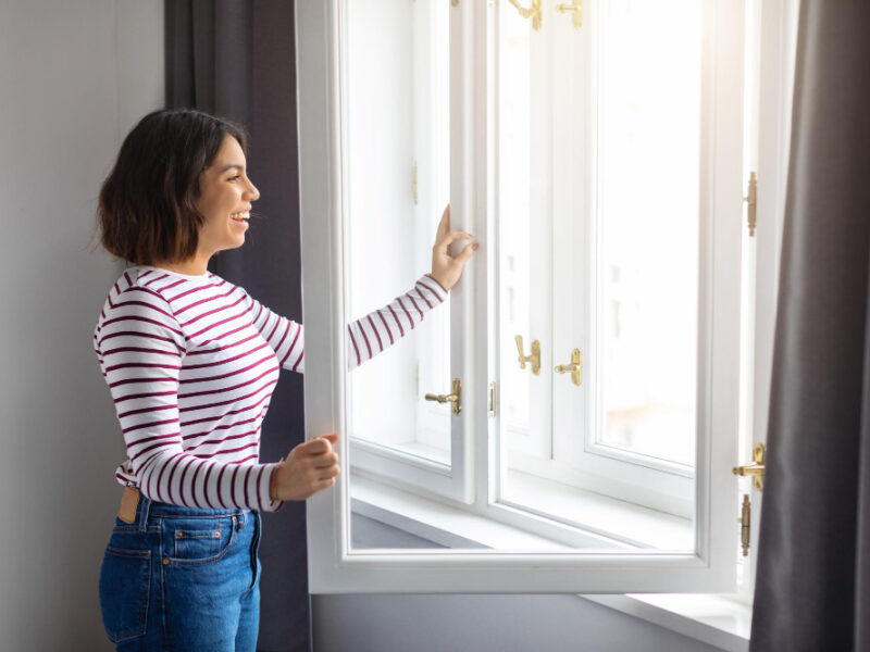 Portrait Young Smiling Arab Woman Opening Window Home