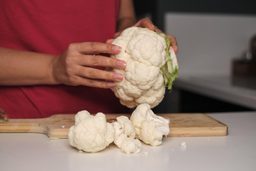 Delicate Hands Break Apart Colorful Cauliflower Modern Kitchen Countertop Discover Joy