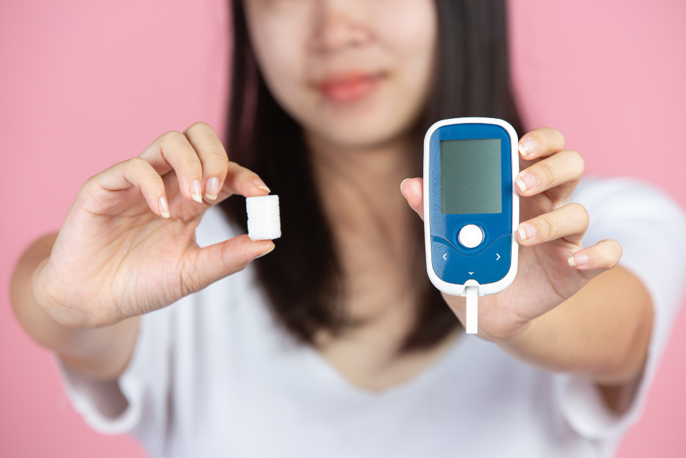World Diabetes Day Woman Holding Glucose Meter Sugar Cubes Pink Wall