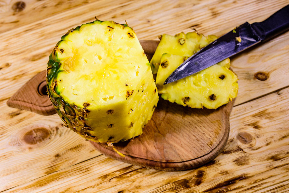 Cutting Board With Halved Pineapple Rustic Wooden Table