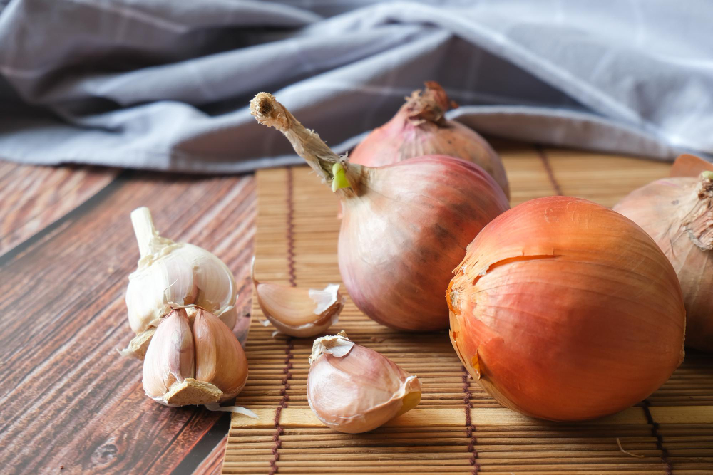 Onion Garlic Cloves With Wooden Texture Background
