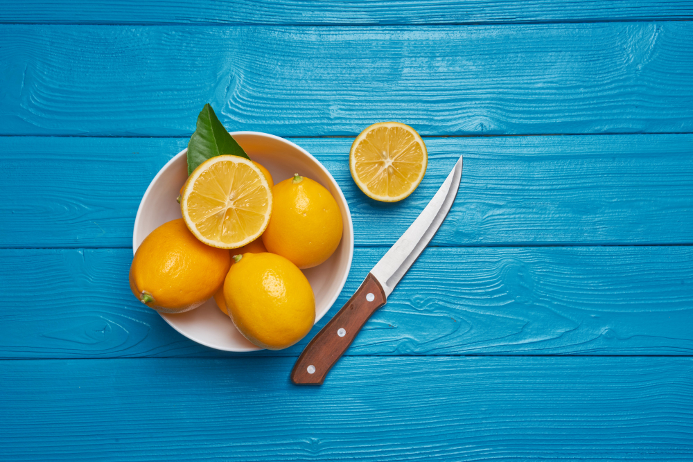 Fresh Ripe Lemons Knife Blue Wooden Table Top View With Copy Space