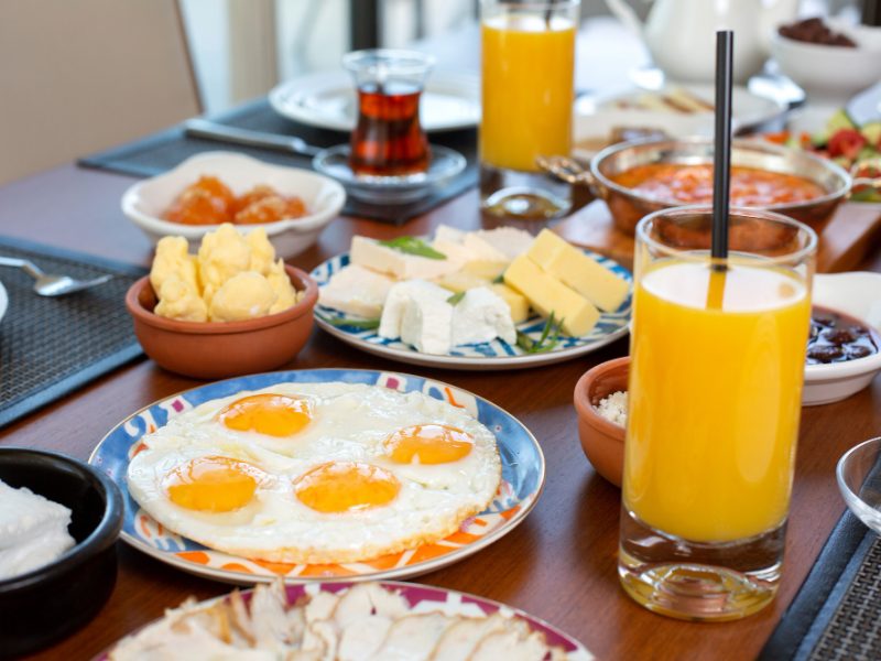 Front View Breakfast Table With Eggs Buns Cheese Fresh Juice Restaurant During Daytime Food Meal Breakfast