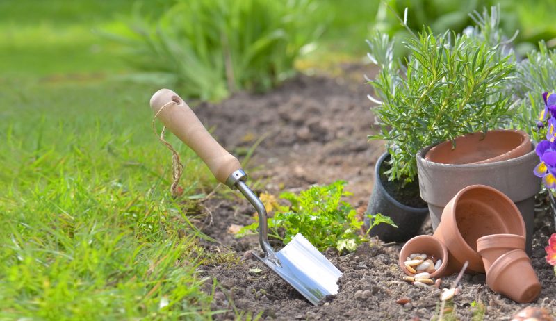 shovel-planted-soil-garden-flowerpots