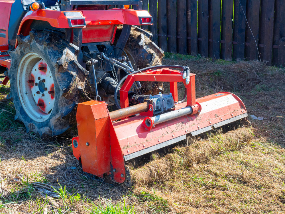 Close Up Tractor With Chain Mower Chopping Dry Grass Maintenance Territory Mulching Grass Agricultural Machinery
