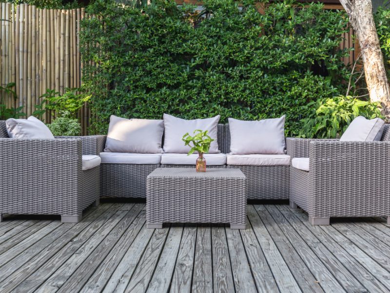 large-terrace-patio-with-rattan-garden-furniture-garden-wooden-floor
