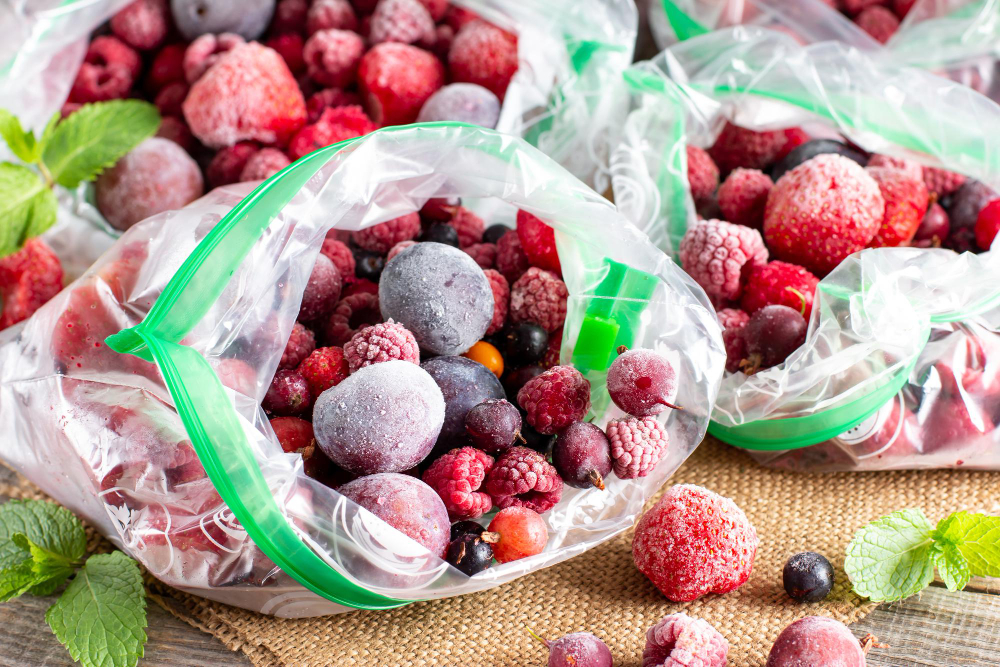 Frozen Berries Black Currant Red Currant Blackberry Blueberry Raspberry Strawberry Cherry Plum Plastic Bag Wooden Table Frozen Food