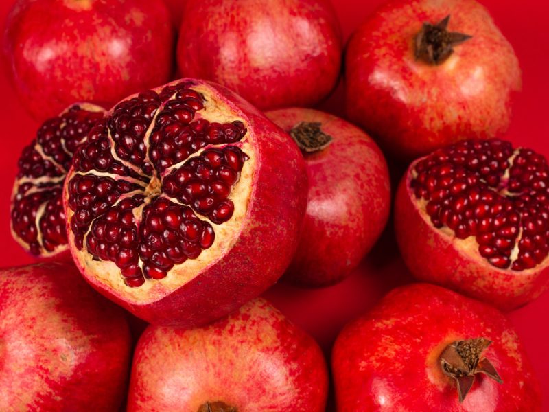 sweet-pomegranate-red-background-top-view